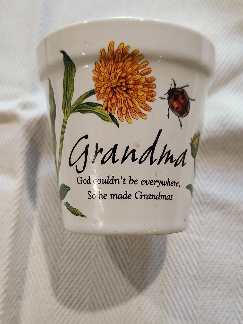 Grandma Floral Ceramic Candle- White with Yellow Flower History & Heraldry